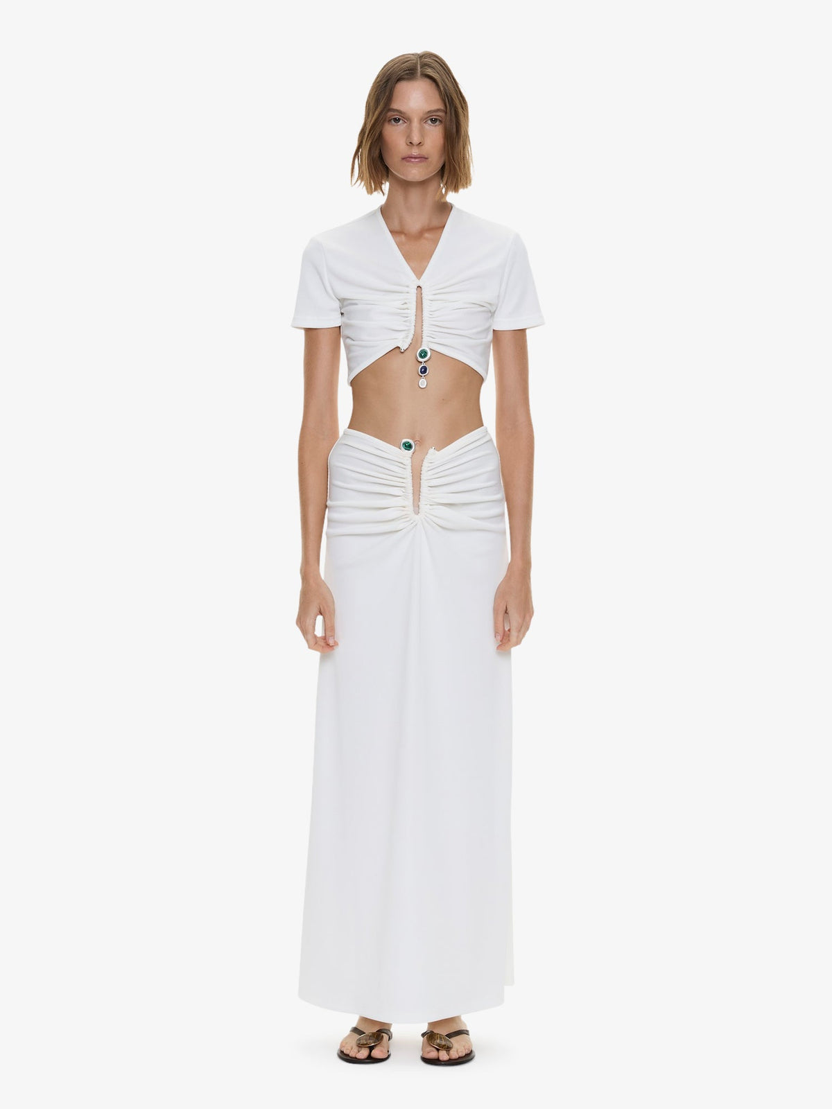 Image of a model wearing Tops. Product name - Droplet Crystal Pendant Ruched Tee in White colour by brand - CHRISTOPHER ESBER