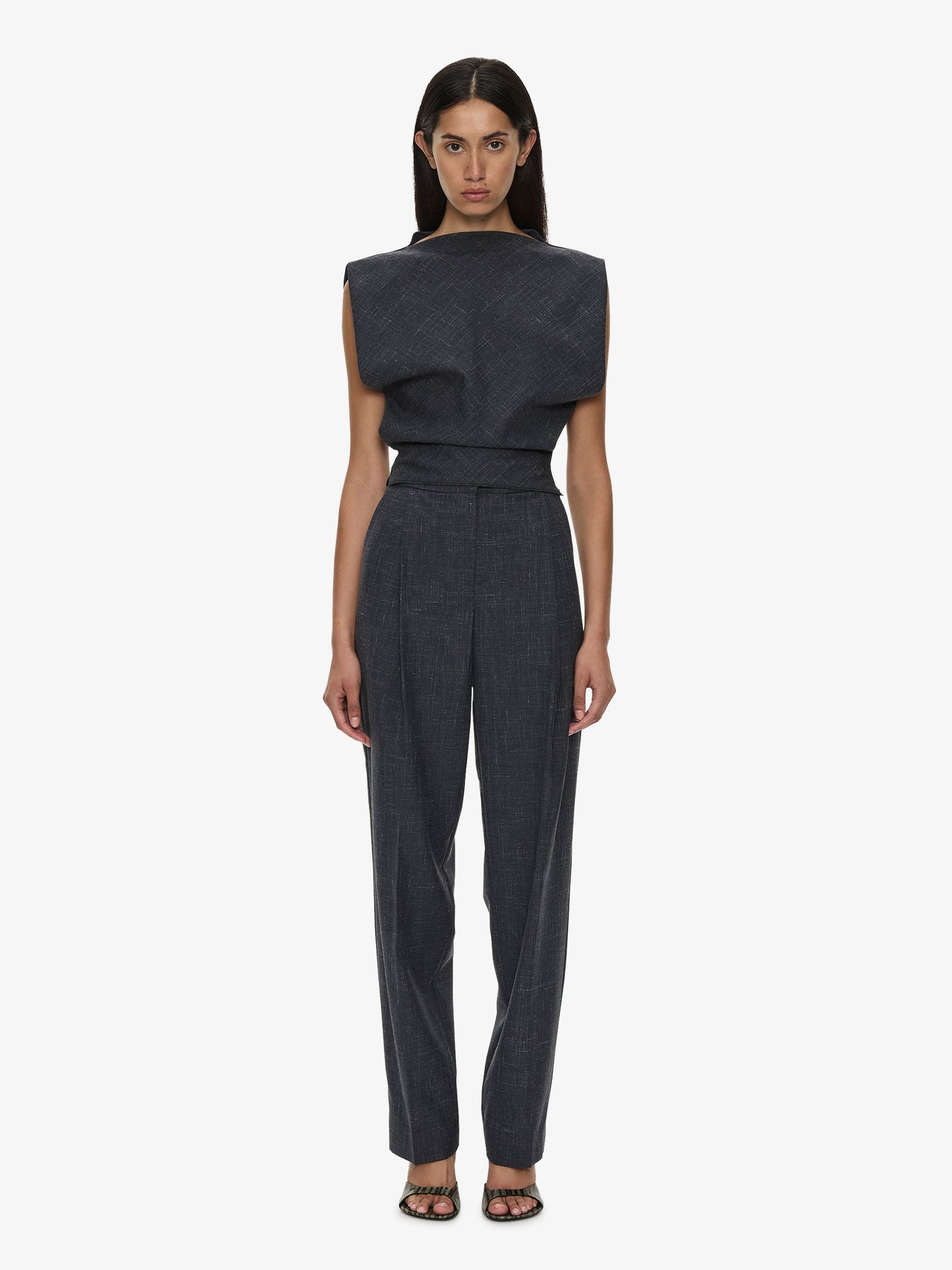 Image of a model wearing Pants. Product name - Banyan Tailored Trouser in Marle colour by brand - CHRISTOPHER ESBER