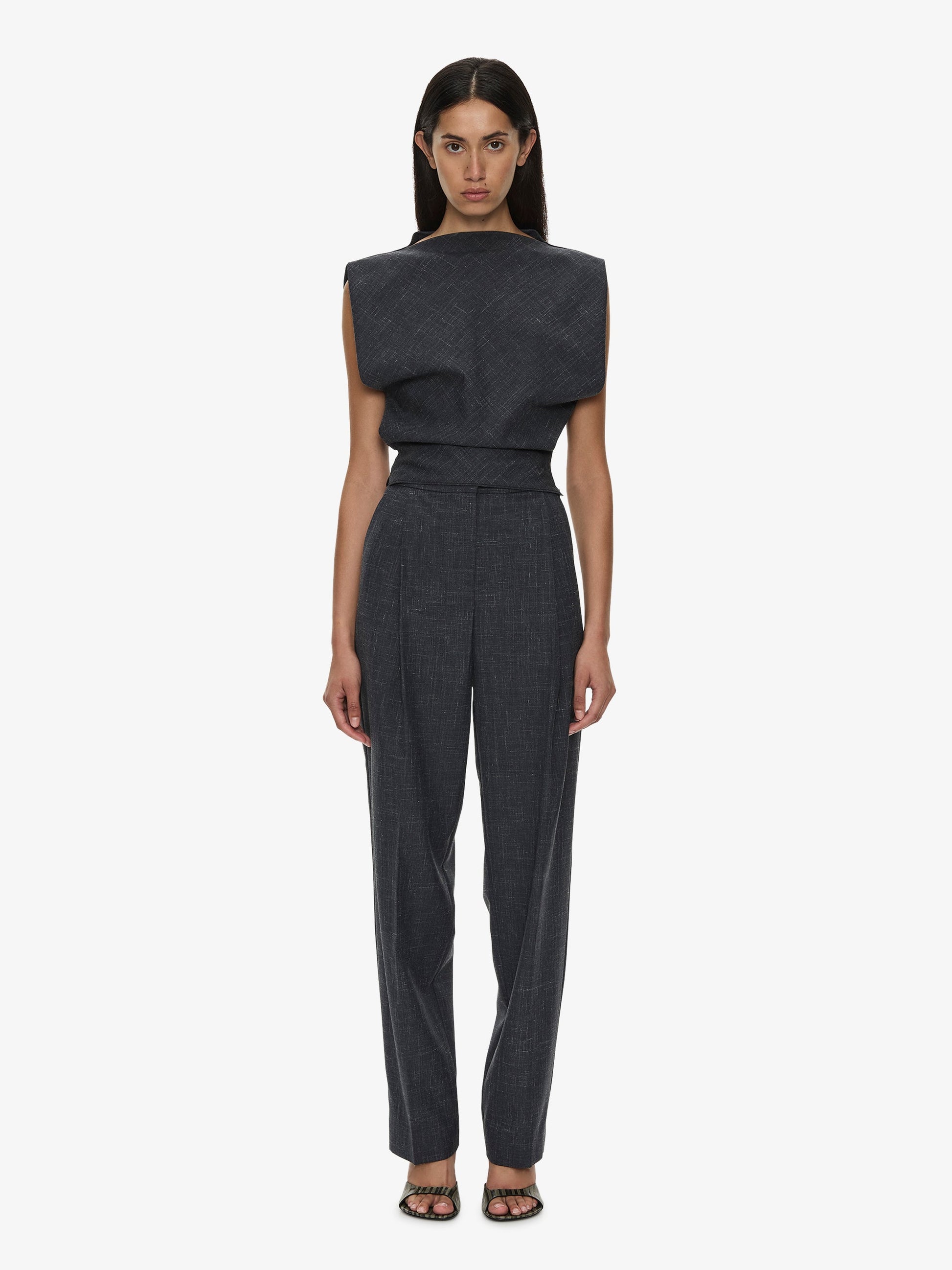 Image of a model wearing Pants. Product name - Banyan Tailored Trouser in Marle colour by brand - CHRISTOPHER ESBER