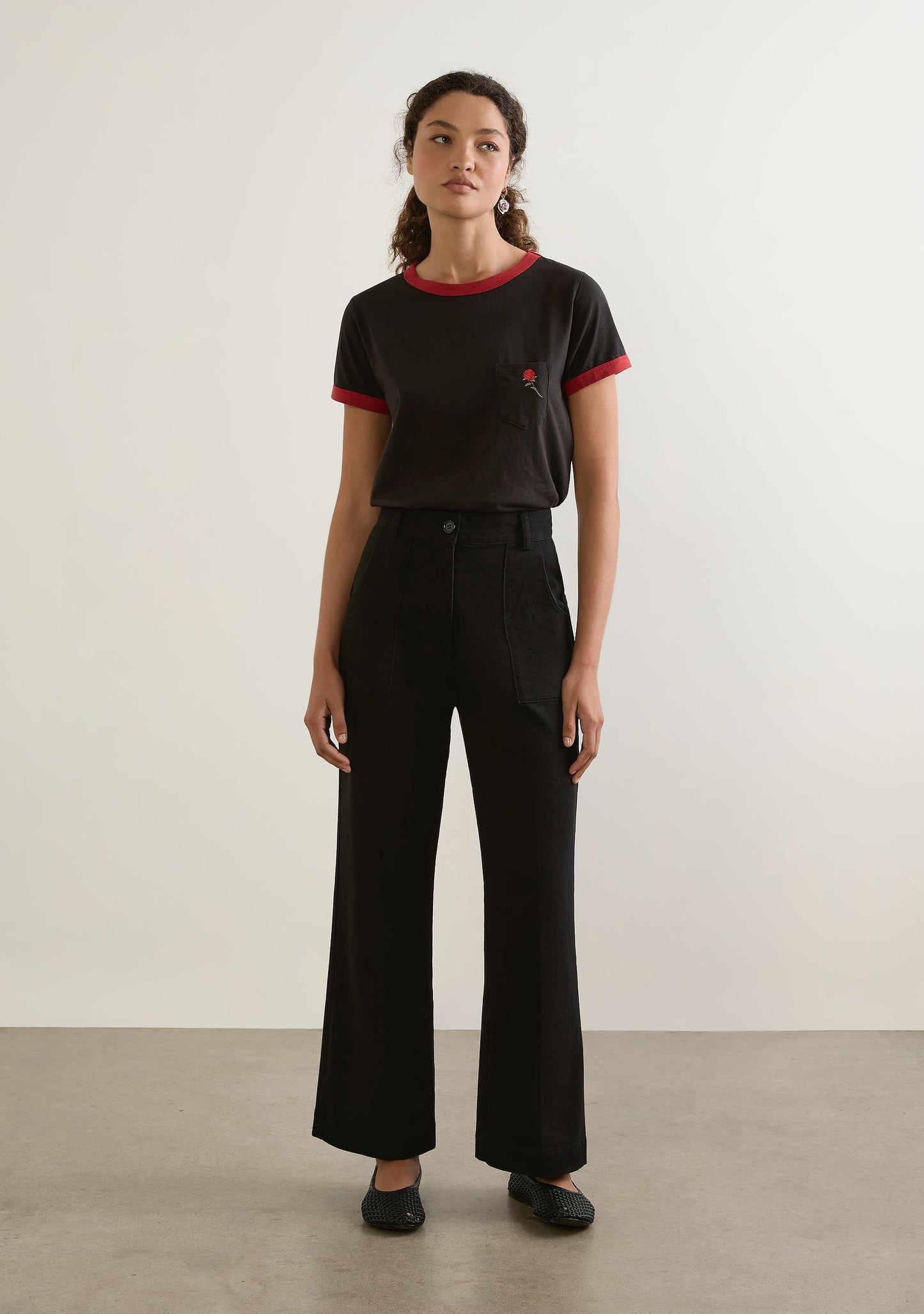 Image of a model wearing Pants. Productname: Auguste The Label James Bootleg Pant in Black colour by brand - Auguste The Label