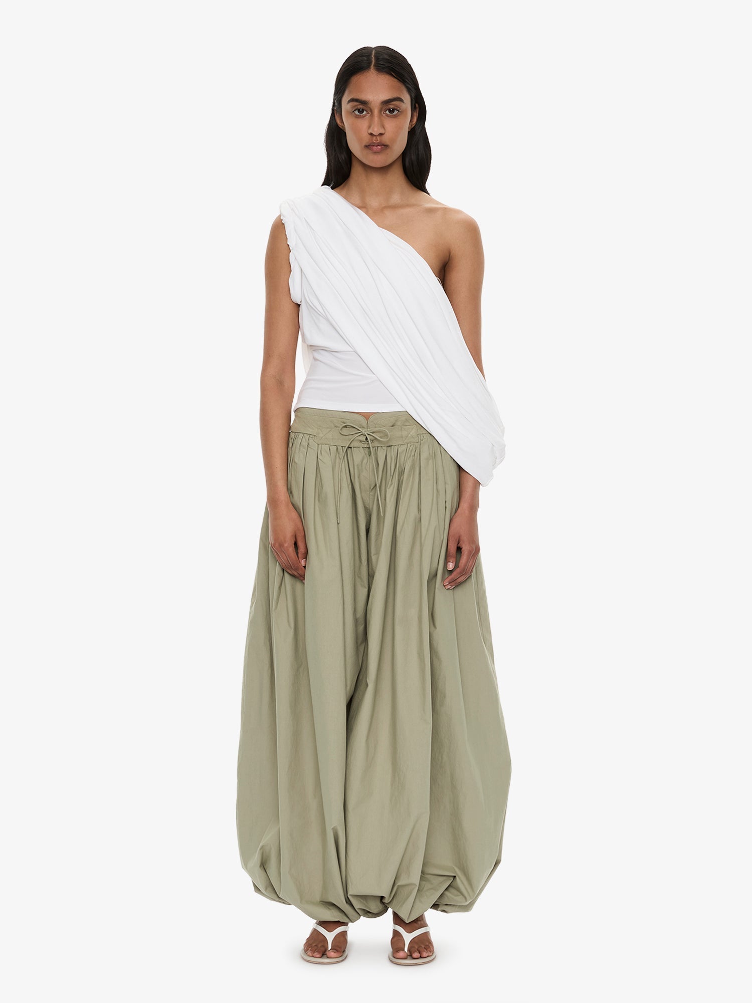 Image of a model wearing Pants. Product name - Drift Tapered Trouser in Khaki colour by brand - CHRISTOPHER ESBER