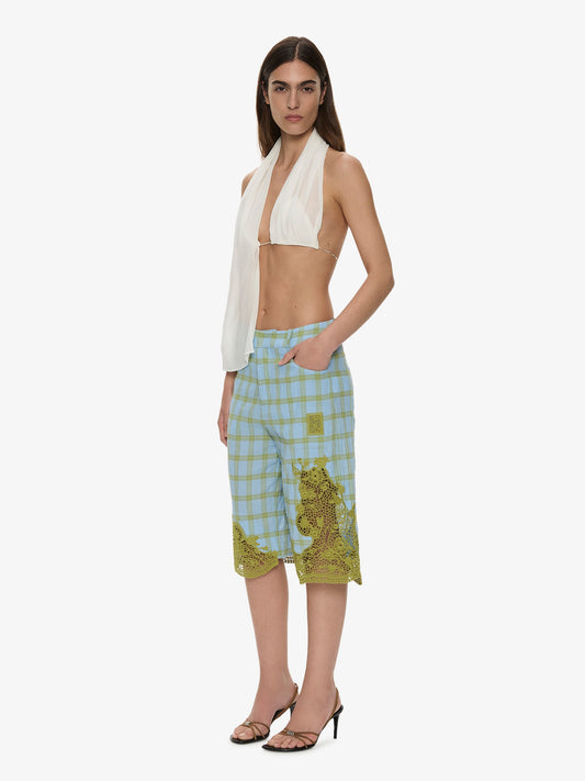 Image of a model wearing Shorts. Product name - Maya Embroidered Handkerchief Shorts in Check colour by brand - CHRISTOPHER ESBER