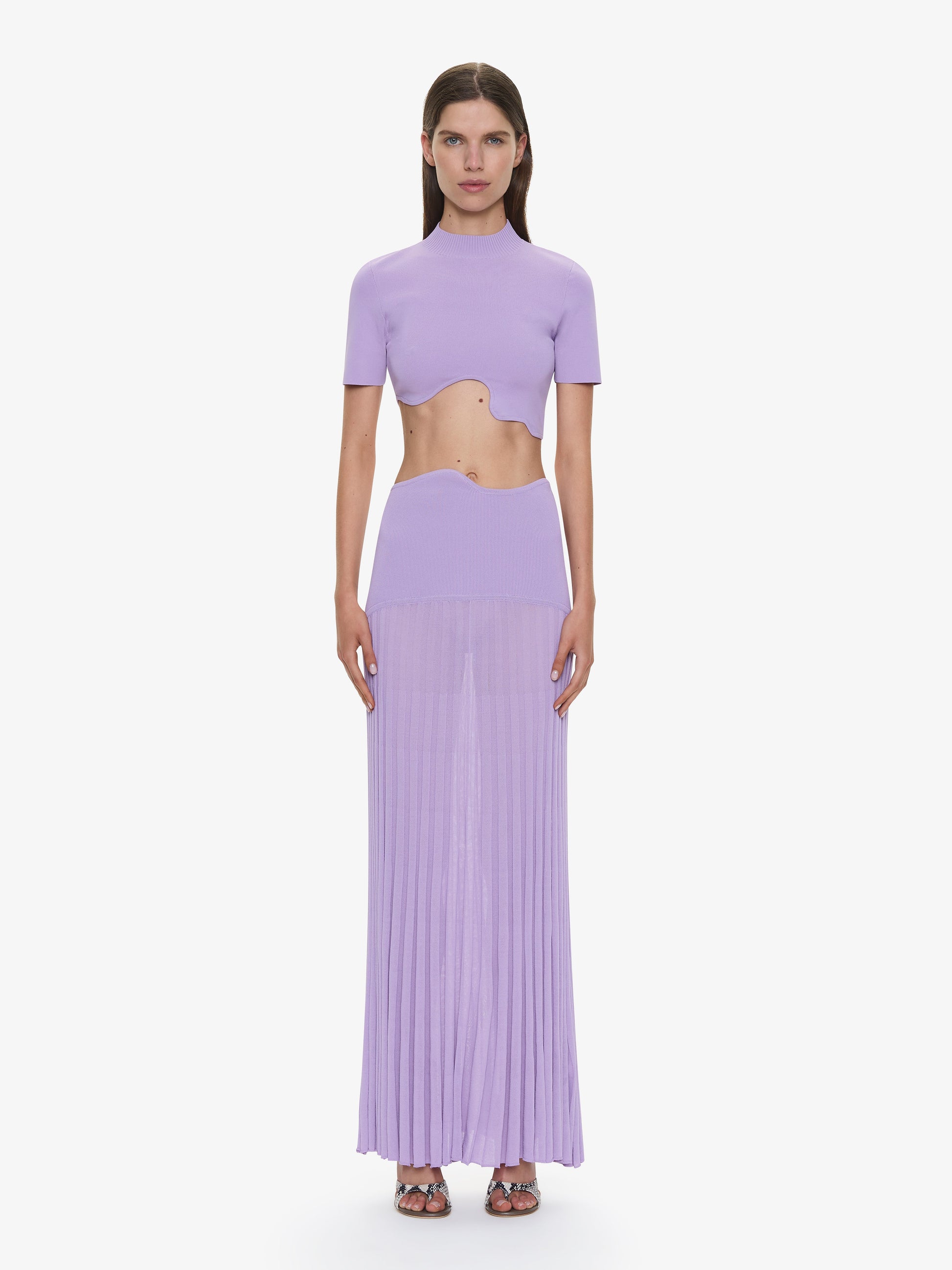 Image of a model wearing Skirts. Productname: CHRISTOPHER ESBER Maparadita Pleated Skirt in Lilac colour by brand - CHRISTOPHER ESBER