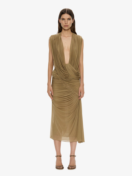Image of a model wearing Skirts. Product name - Orion Midi Skirt in Khaki colour by brand - CHRISTOPHER ESBER