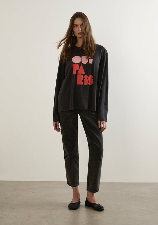 Image of a model wearing Tops. Productname: Auguste The Label Oui Paris North Long Sleeve Tee in Black colour by brand - Auguste The Label