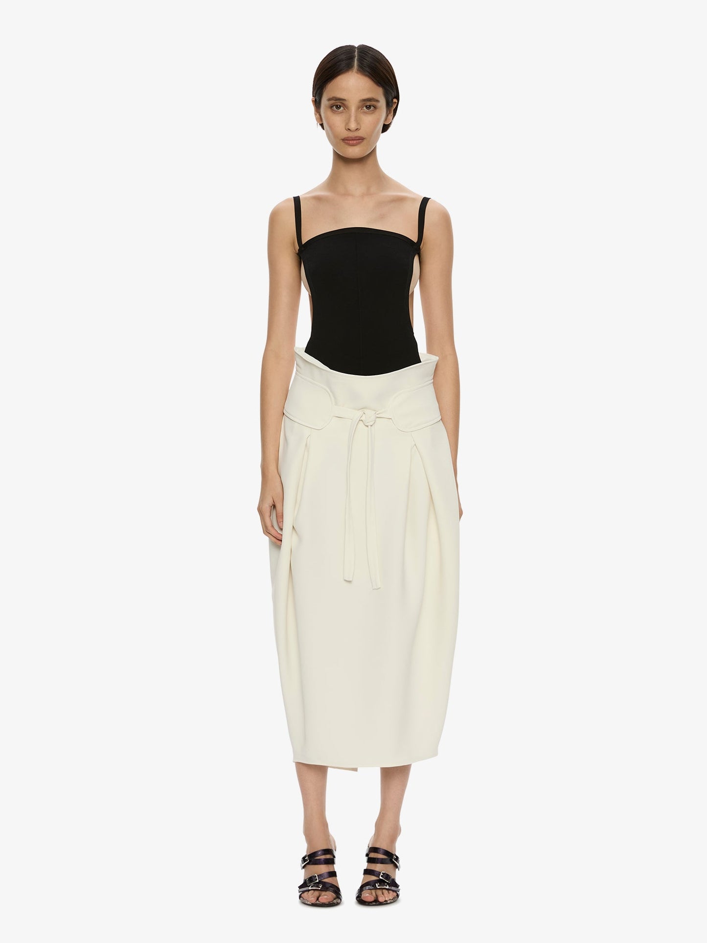 Image of a model wearing Skirts. Product name - Virelle Cocoon Skirt in Cream colour by brand - CHRISTOPHER ESBER