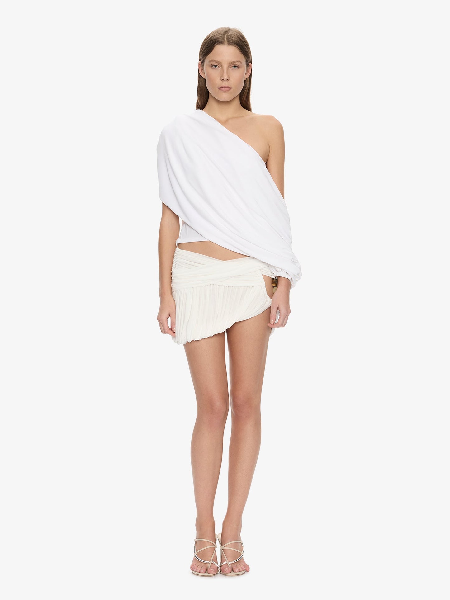 Image of a model wearing Skirts. Product name - Beach Glass Bubble Mini Skirt in White colour by brand - CHRISTOPHER ESBER