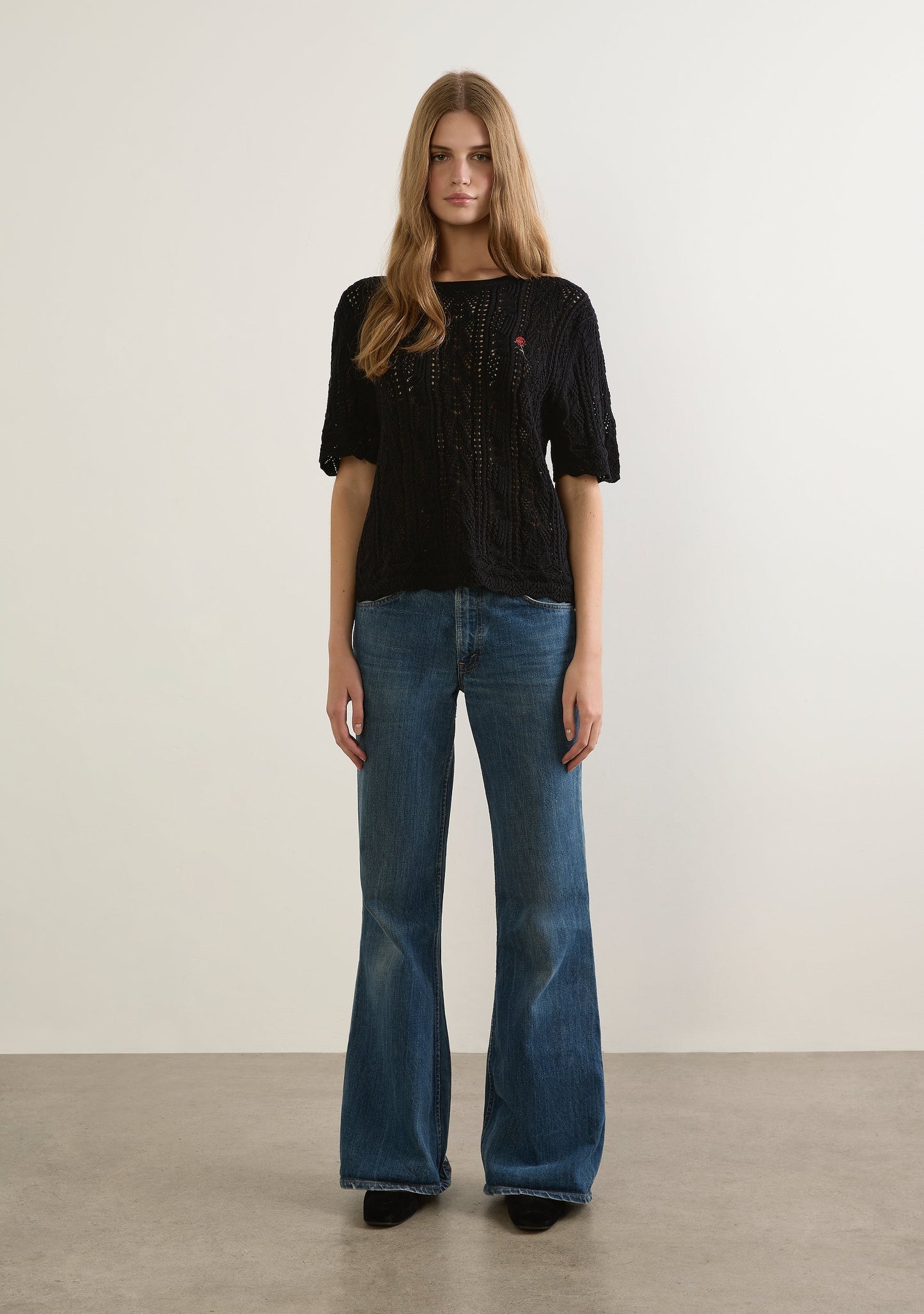 Image of a model wearing Outerwear. Productname: Auguste The Label Callen Knit Tee in Black colour by brand - Auguste The Label
