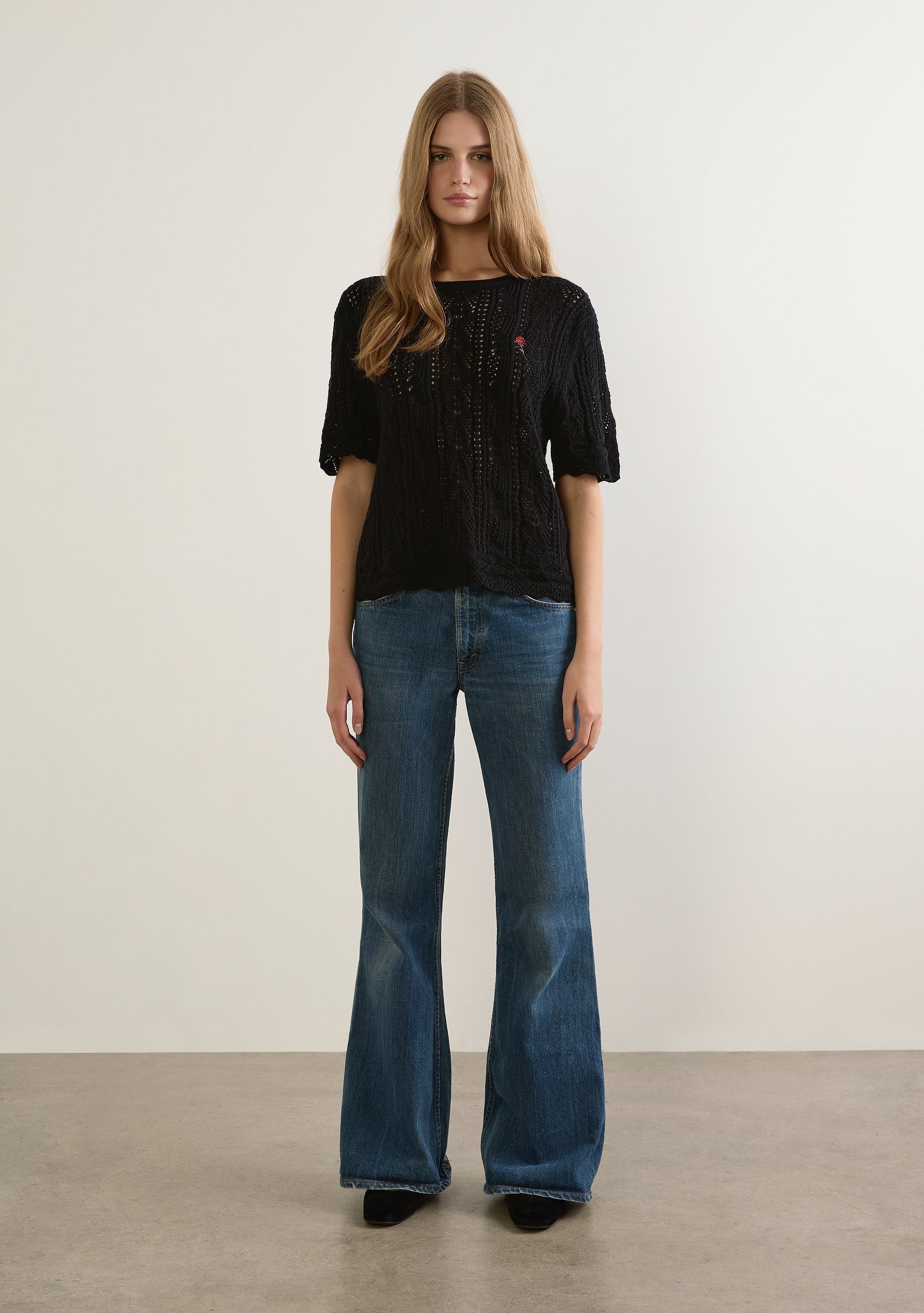 Image of a model wearing Outerwear. Productname: Auguste The Label Callen Knit Tee in Black colour by brand - Auguste The Label