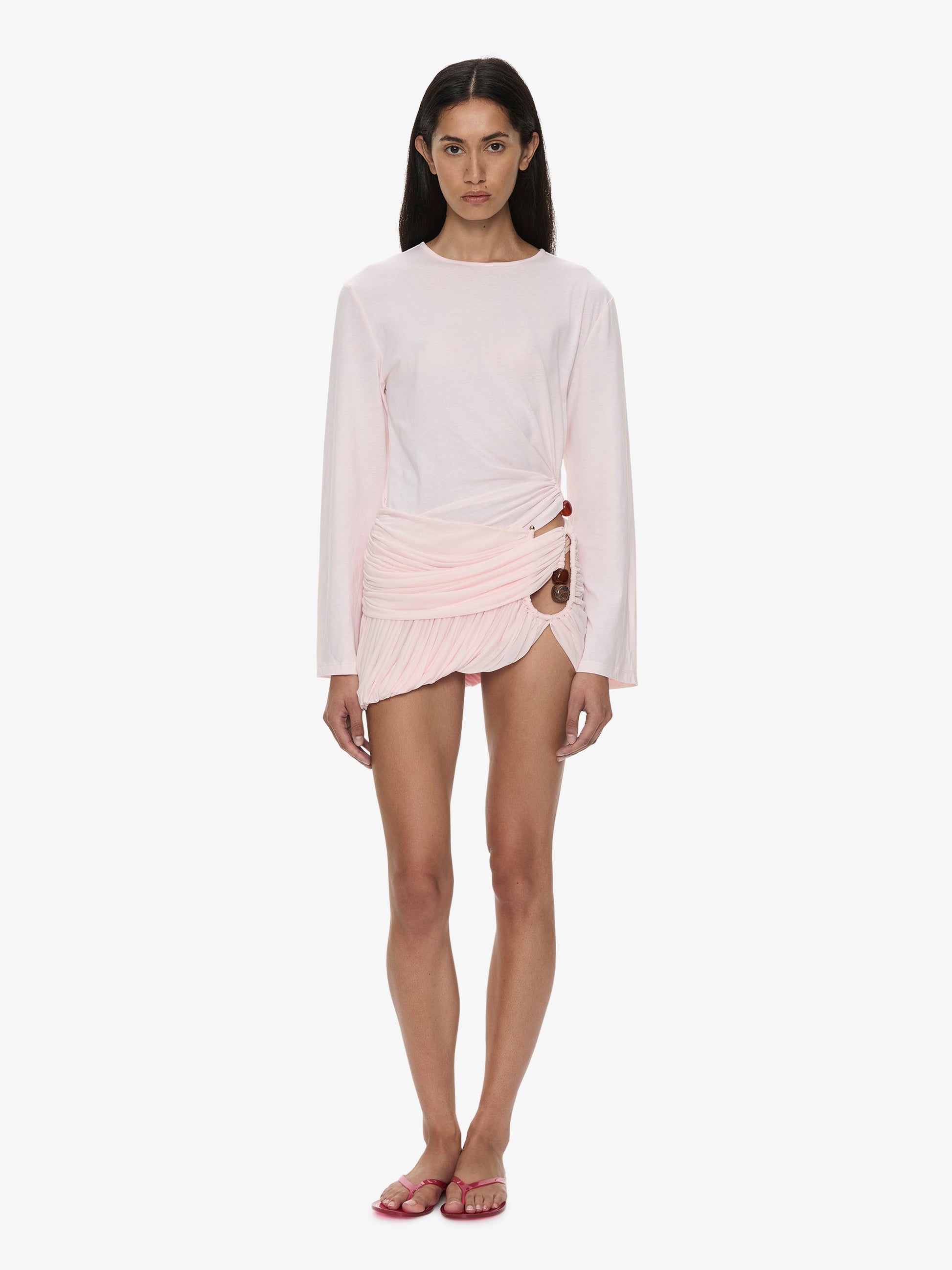Image of a model wearing Skirts. Product name - Beach Glass Bubble Mini Skirt in Pink colour by brand - CHRISTOPHER ESBER