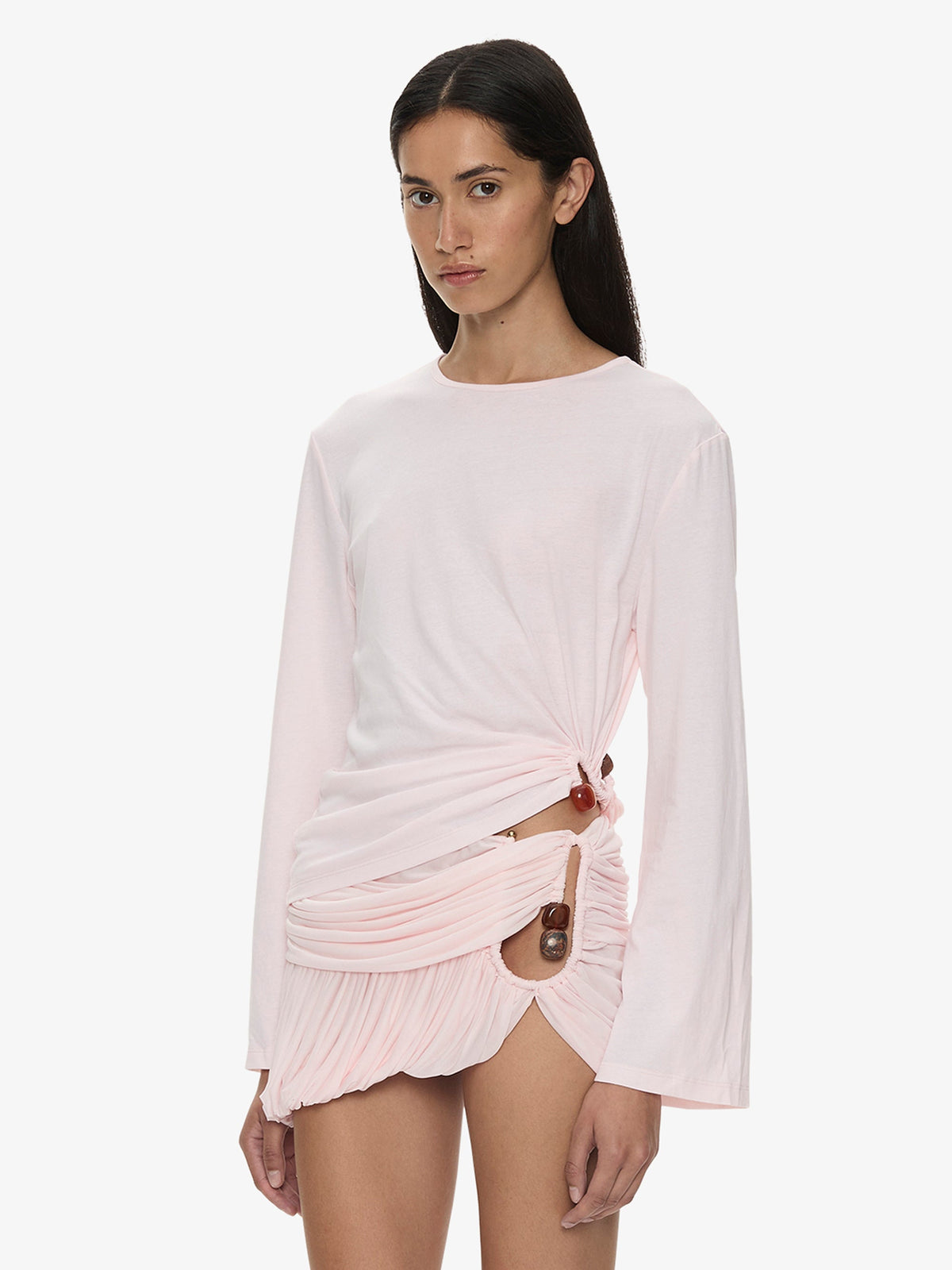 Image of a model wearing Tops. Product name - Bree Quartz Long Sleeve Tee in Pink colour by brand - CHRISTOPHER ESBER