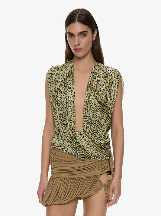 Image of a model wearing Tops. Product name - Ripple Drape Top in Citrine colour by brand - CHRISTOPHER ESBER