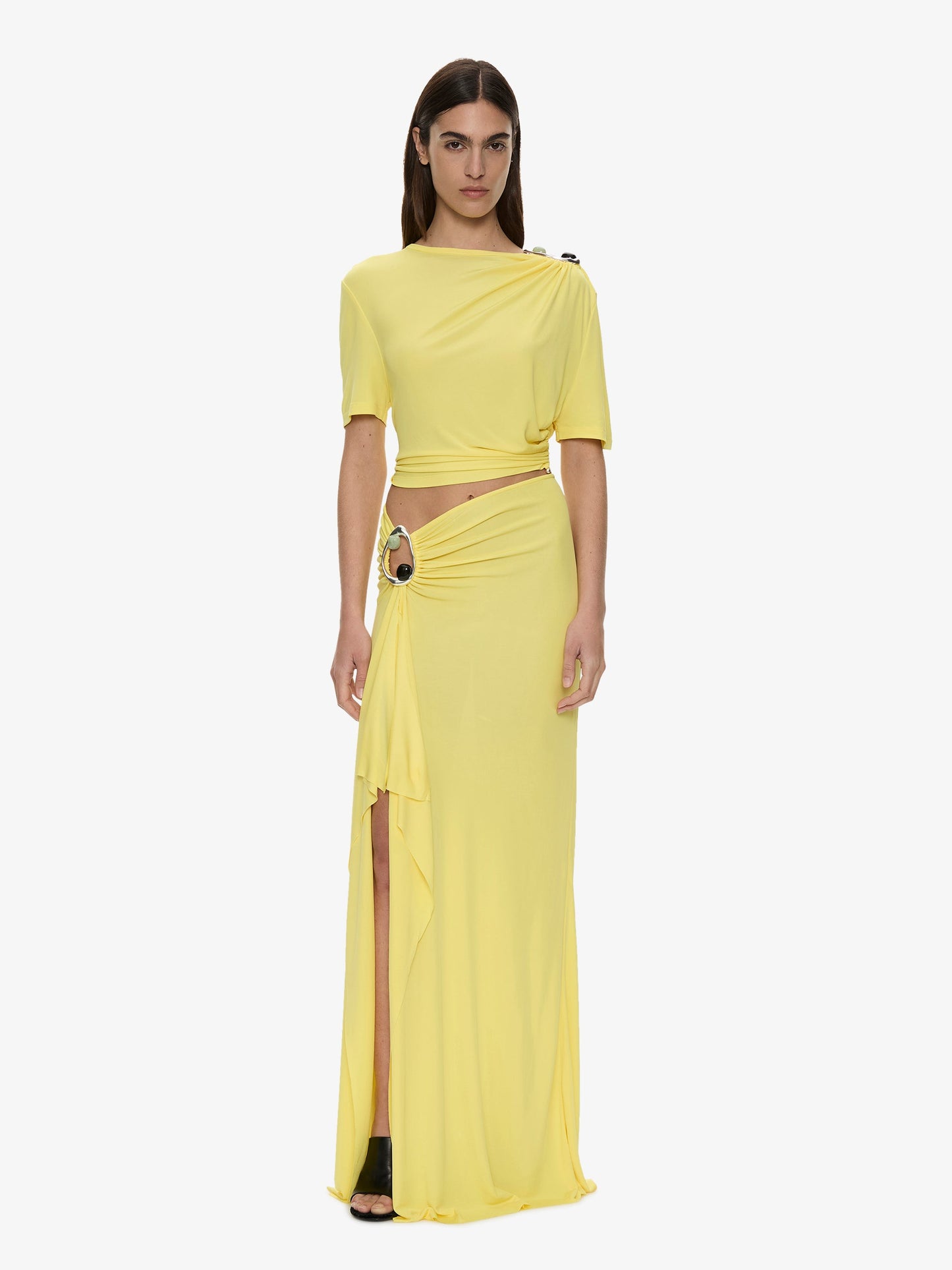 Image of a model wearing Skirts. Product name - Orica Crystal Cascade Jersey Skirt in Yellow colour by brand - CHRISTOPHER ESBER