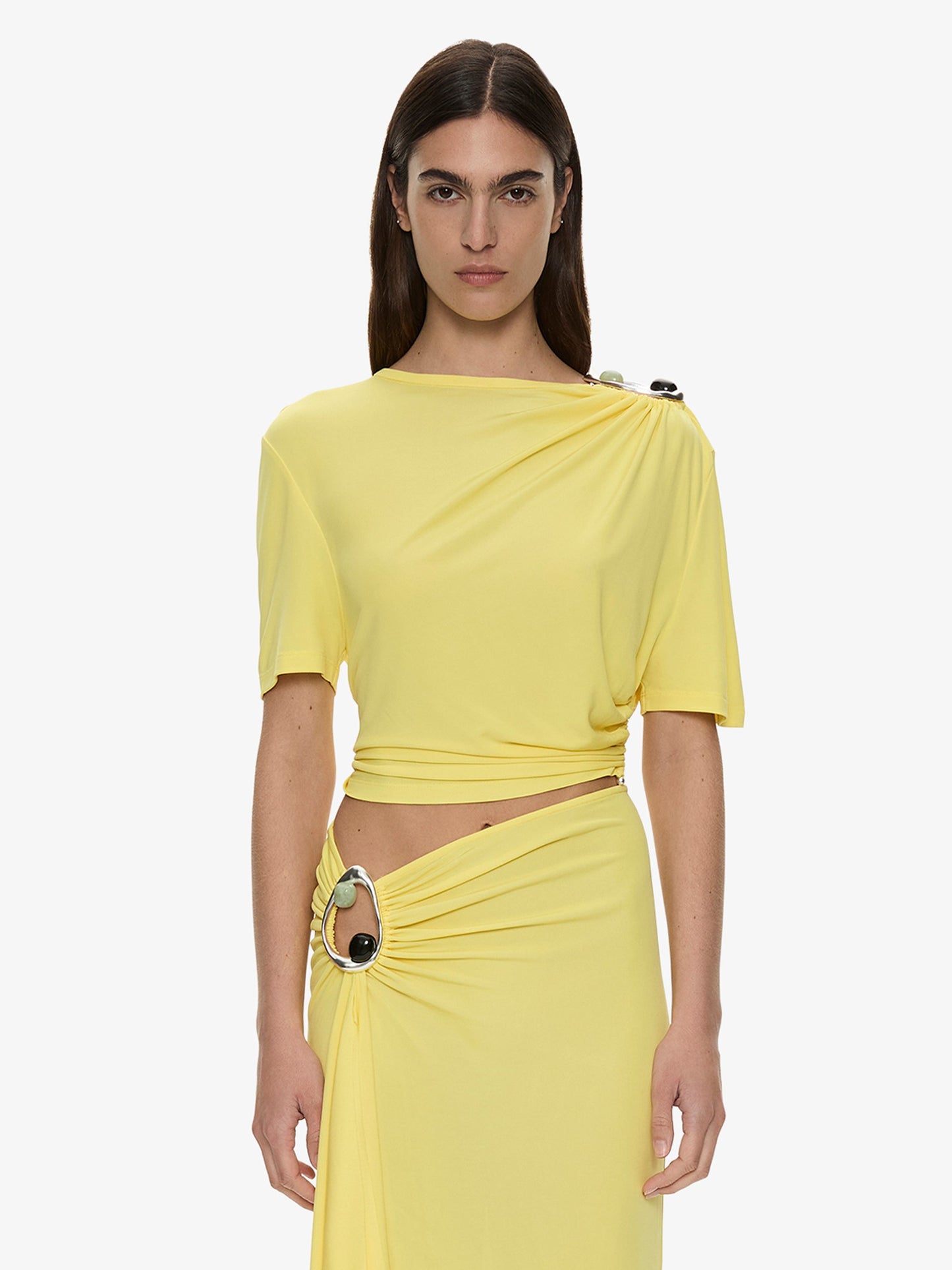 Image of a model wearing Tops. Product name - Orica Crystal Ruched Jersey Tee in Yellow colour by brand - CHRISTOPHER ESBER