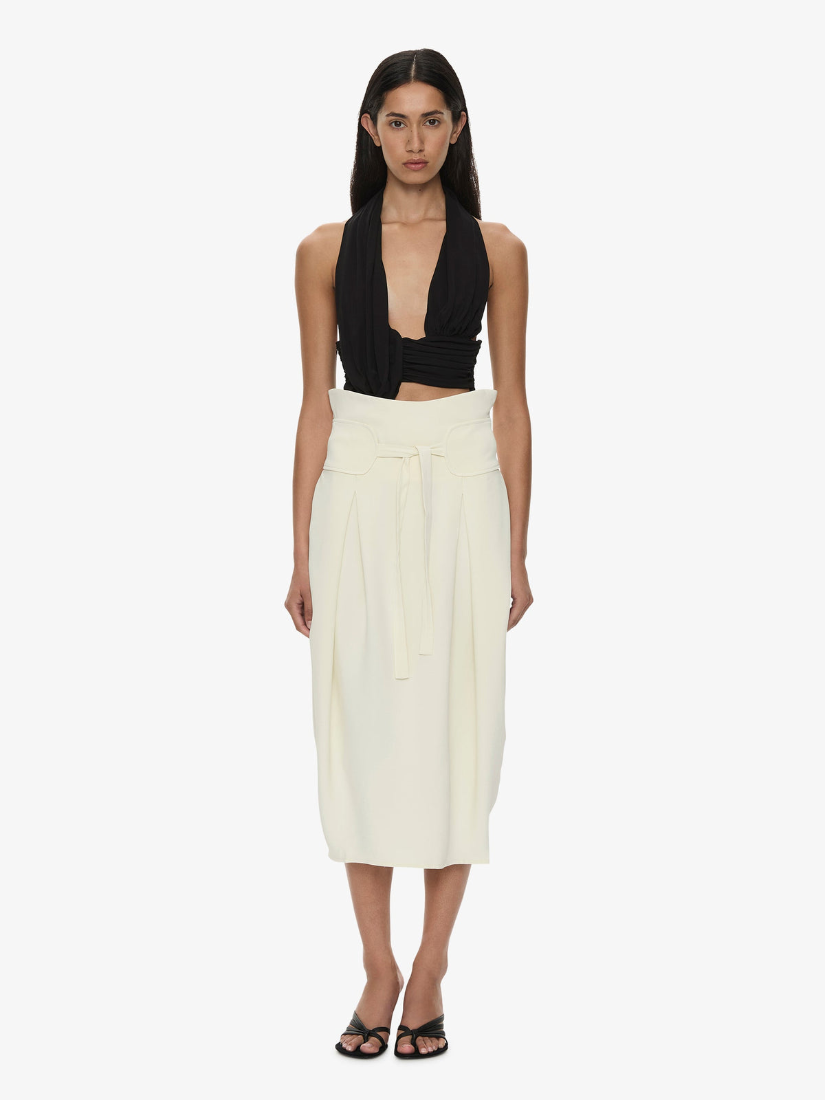 Image of a model wearing Skirts. Product name - Virelle Cocoon Skirt in Cream colour by brand - CHRISTOPHER ESBER