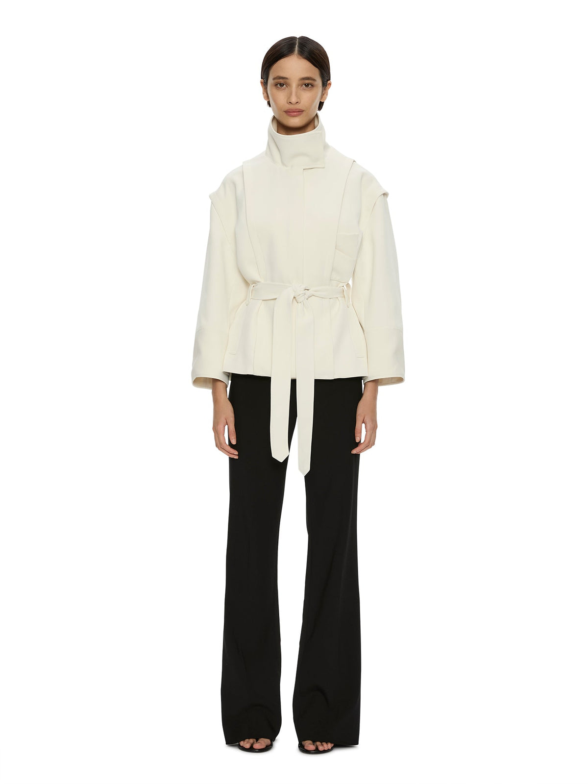 Image of a model wearing Outerwear. Product name - Virelle Parapet Drift Jacket in Cream colour by brand - CHRISTOPHER ESBER
