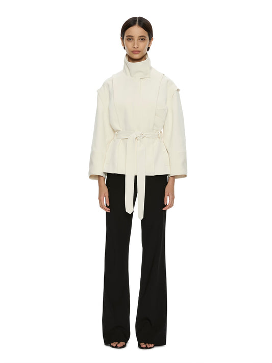Image of a model wearing Outerwear. Product name - Virelle Parapet Drift Jacket in Cream colour by brand - CHRISTOPHER ESBER