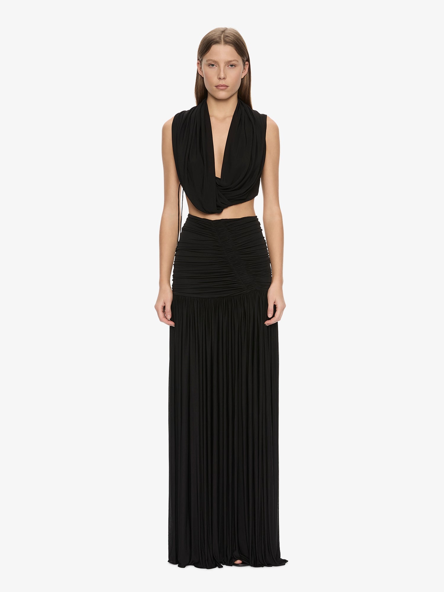 Image of a model wearing Skirts. Product name - Orion Skirt in Black colour by brand - CHRISTOPHER ESBER