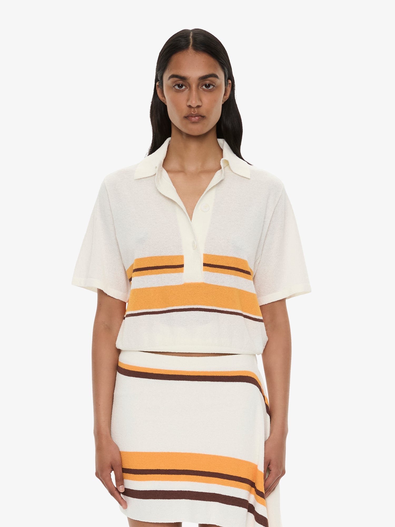Image of a model wearing Tops. Product name - Stripe Knit Clean Polo in Stripe colour by brand - CHRISTOPHER ESBER