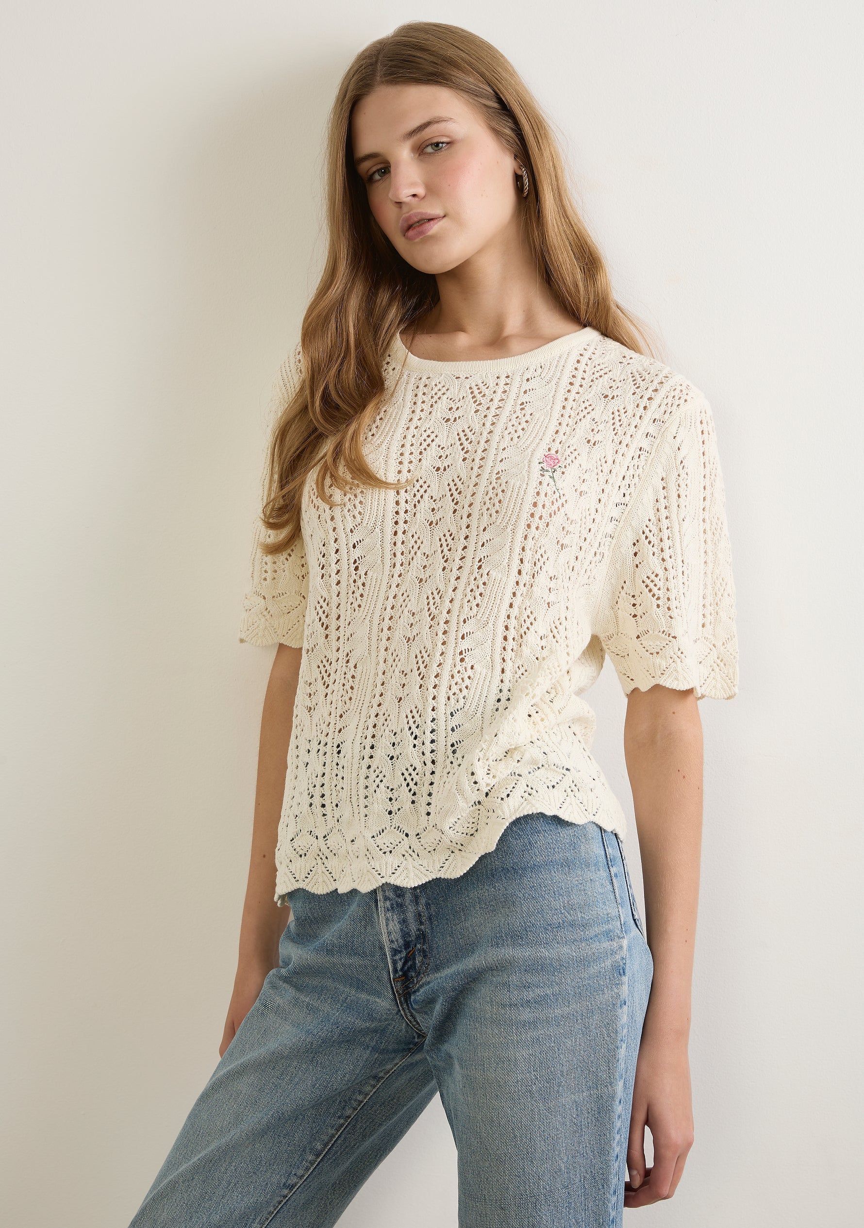 Image of a model wearing Outerwear. Productname: Auguste The Label Callen Knit Tee in White colour by brand - Auguste The Label