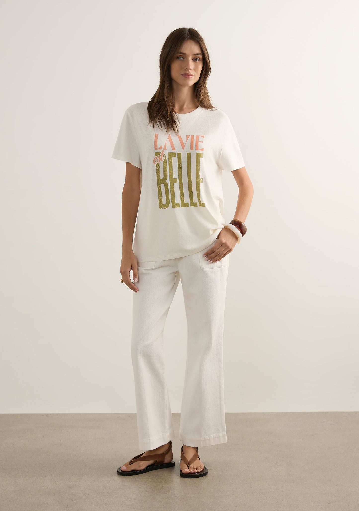 Image of a model wearing Tops. Productname: Auguste The Label Life Is Beautiful Classic Tee in White colour by brand - Auguste The Label