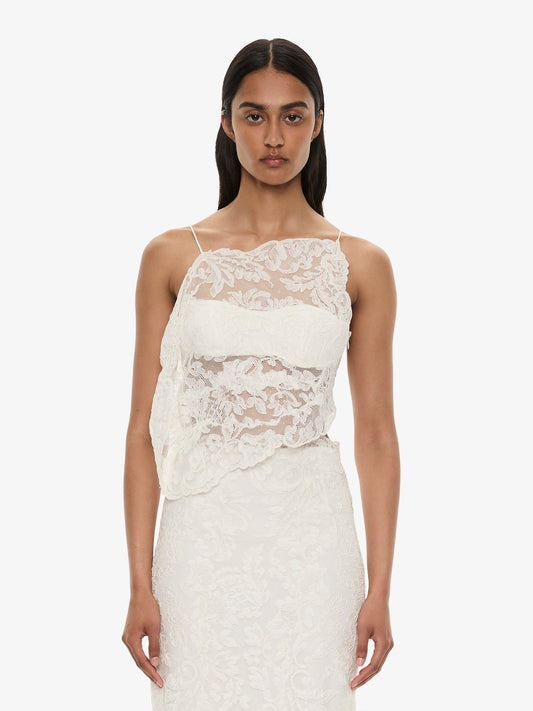 Image of a model wearing Tops. Product name - Reverie Floating Lace Cami in White colour by brand - CHRISTOPHER ESBER
