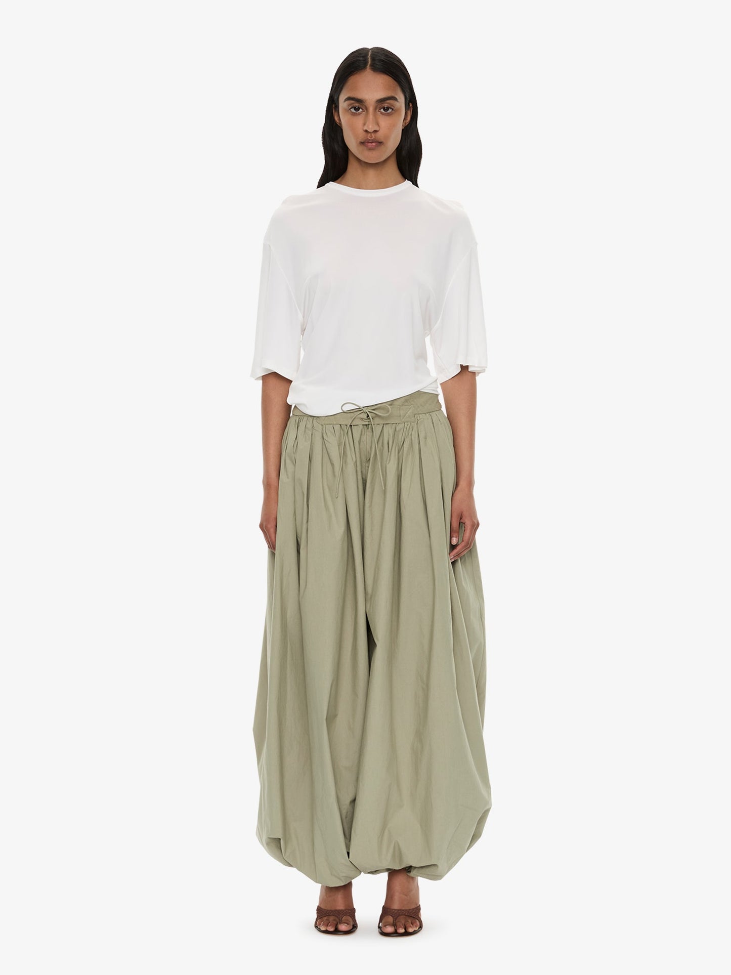 Image of a model wearing Tops. Product name - Side Cowl Waist Tee in Milk colour by brand - Christopher Esber