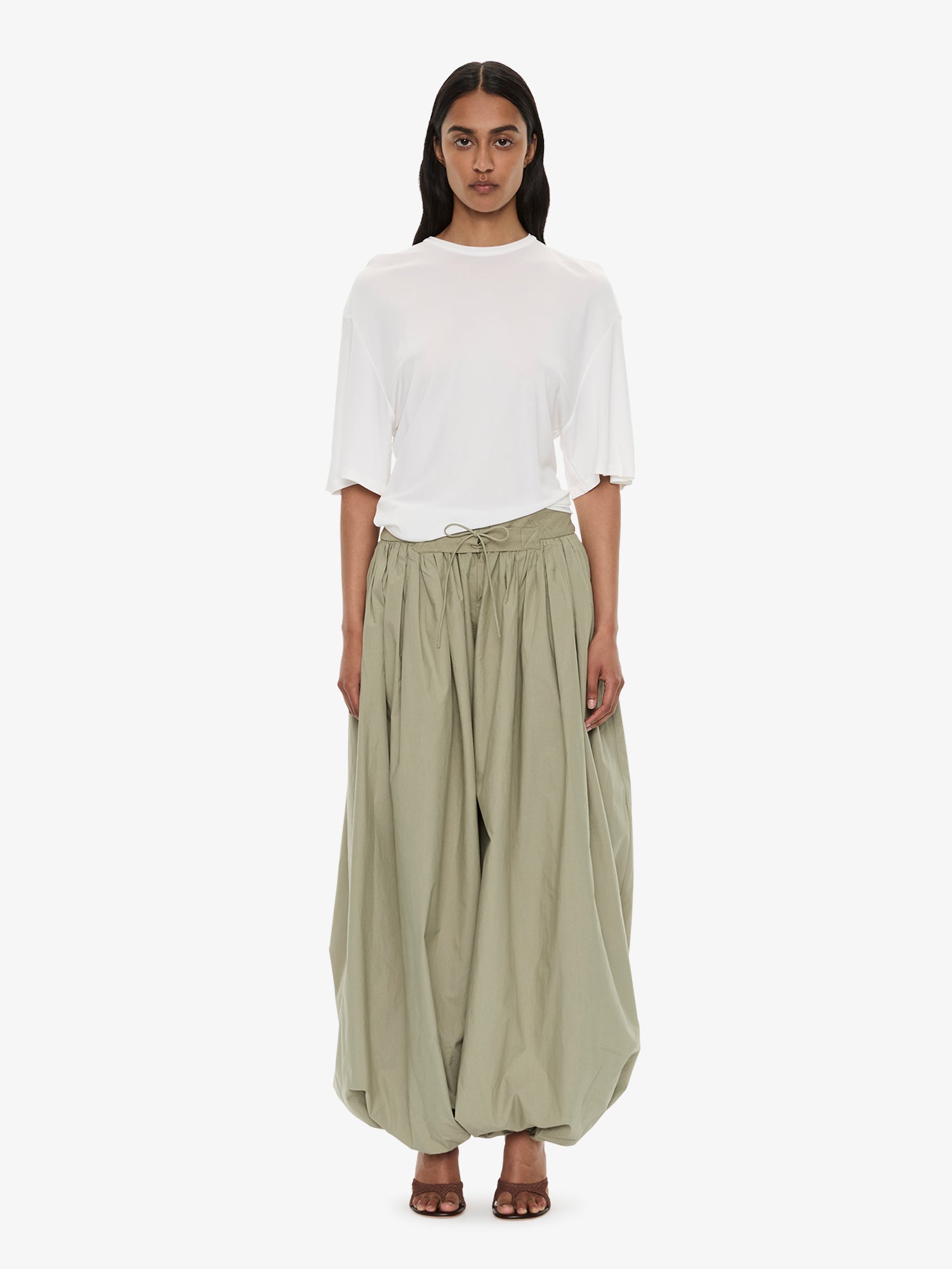 Image of a model wearing Tops. Product name - Side Cowl Waist Tee in Milk colour by brand - Christopher Esber