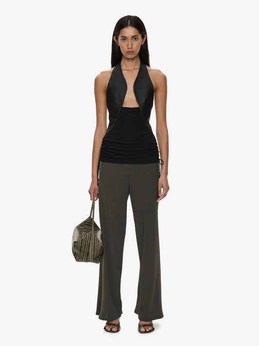 Image of a model wearing Pants. Product name - Bias Crepe Trouser in Green colour by brand - CHRISTOPHER ESBER
