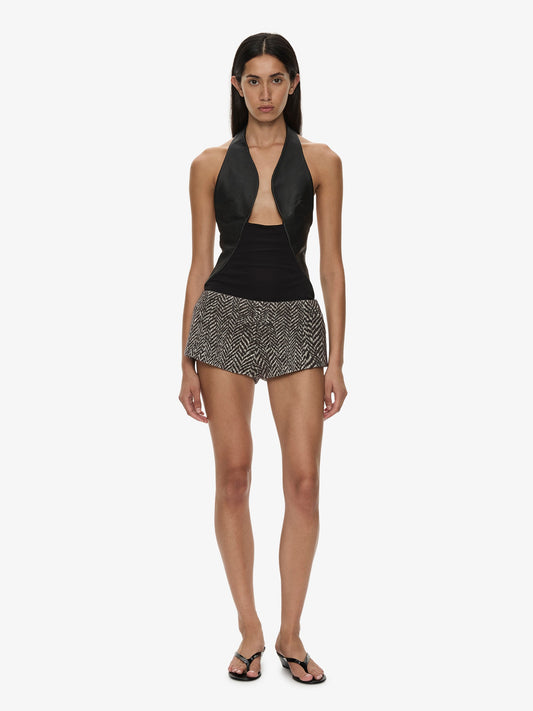 Image of a model wearing Shorts. Product name - Warped Herringbone Tailored Short in White colour by brand - CHRISTOPHER ESBER