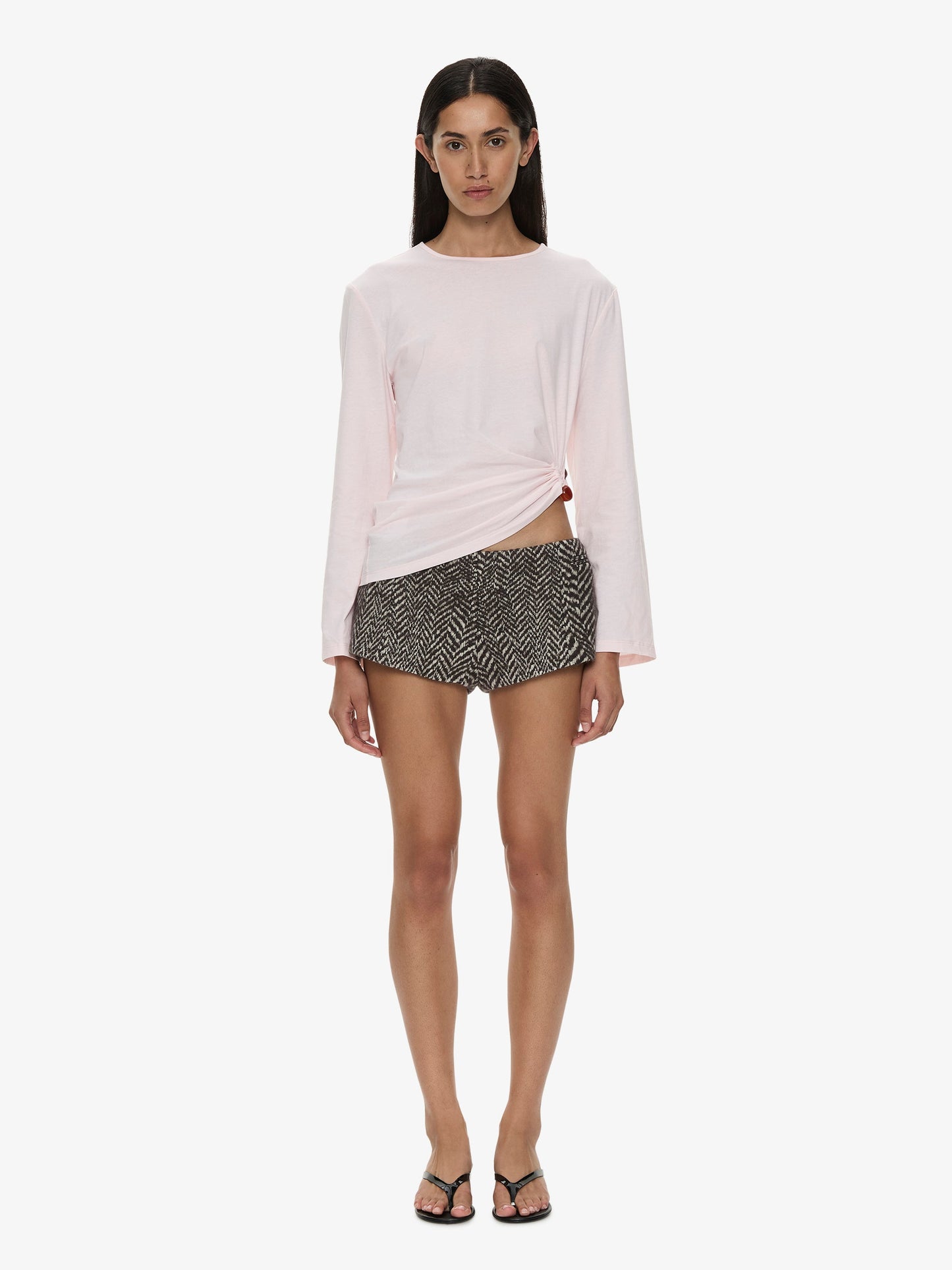 Image of a model wearing Tops. Product name - Bree Quartz Long Sleeve Tee in Pink colour by brand - CHRISTOPHER ESBER