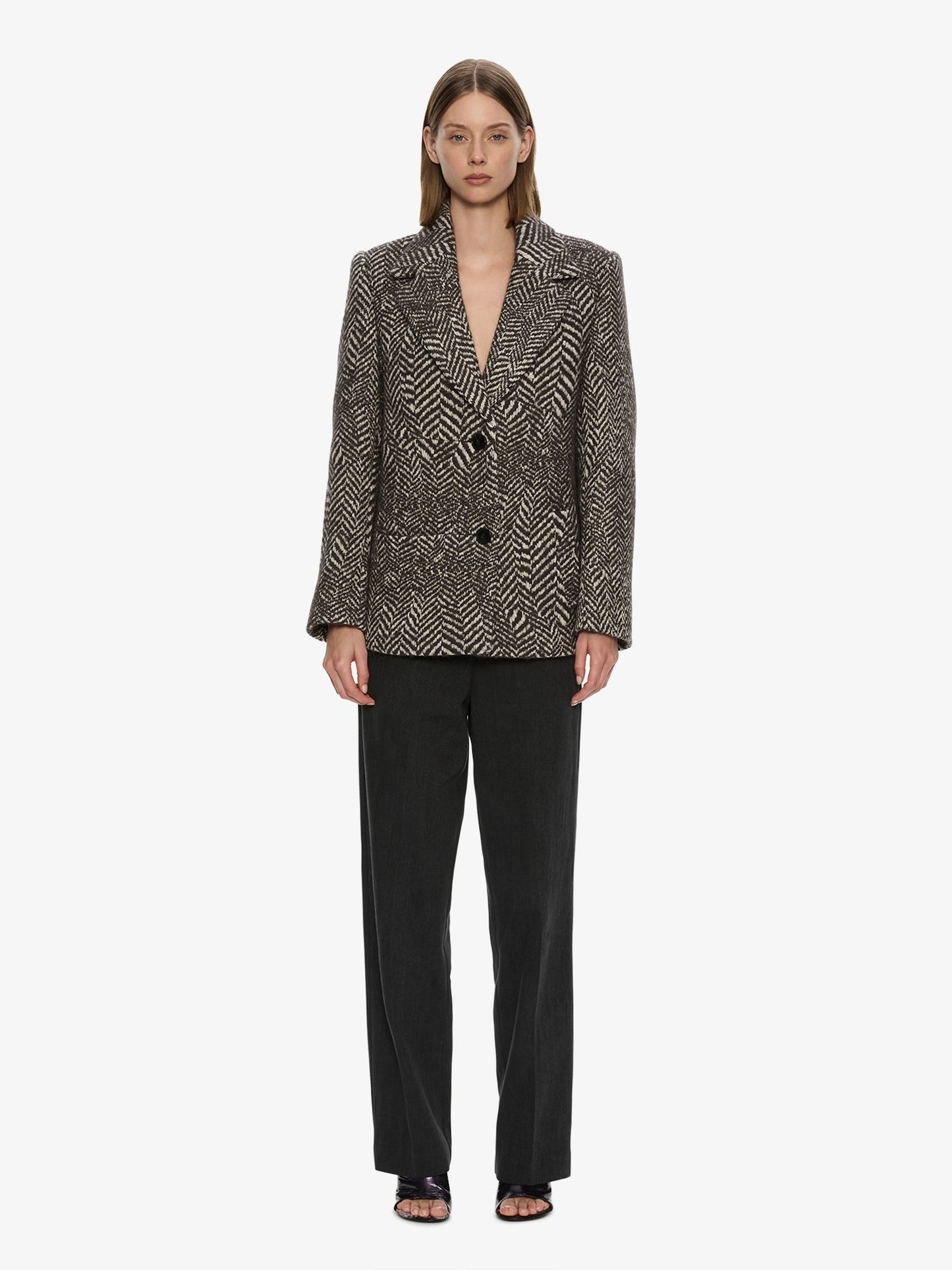 Image of a model wearing Outerwear. Product name - Warped Herringbone Peacoat in White colour by brand - CHRISTOPHER ESBER