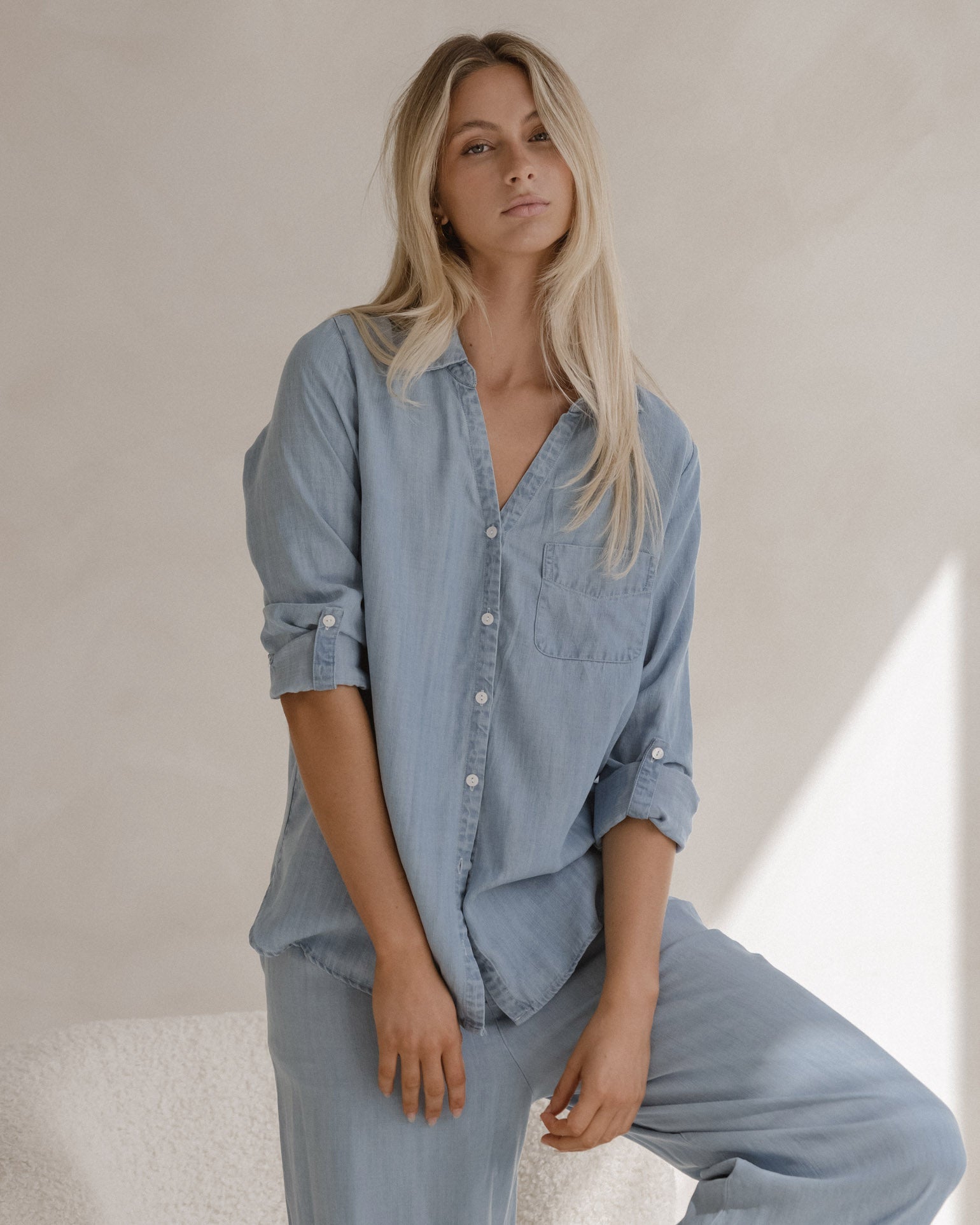 Image of a model wearing Tops. Product name - Rye Shirt Chambray in Chambray colour by brand - Sass Clothing