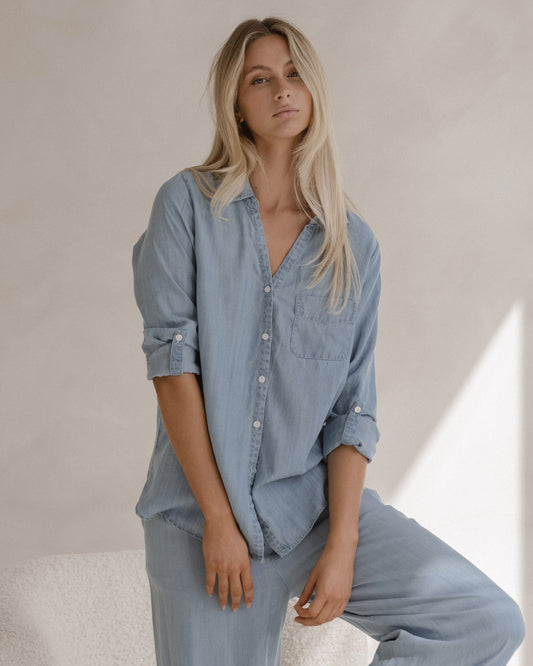 Image of a model wearing Tops. Product name - Rye Shirt Chambray in Chambray colour by brand - Sass Clothing