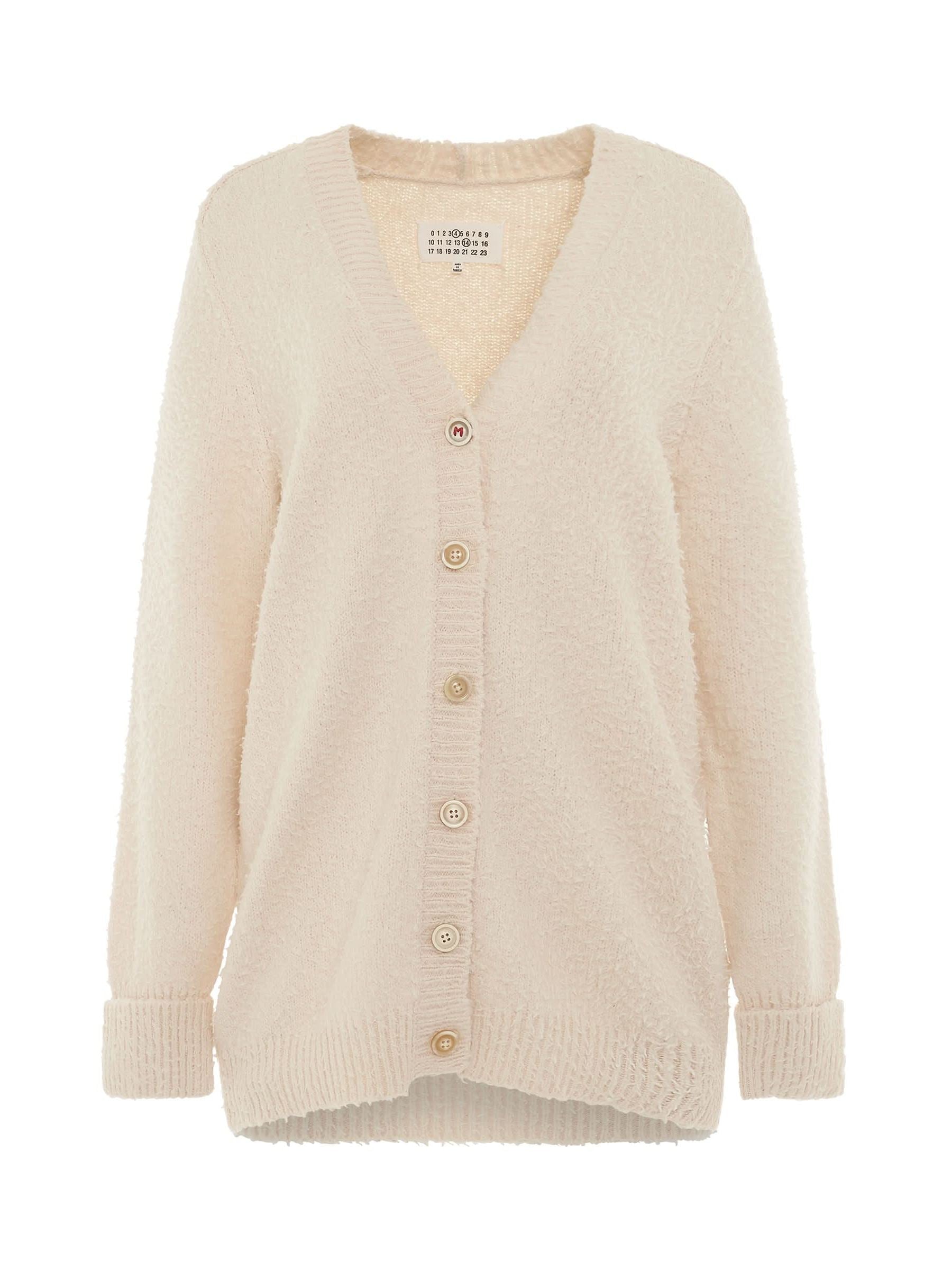 Image of a model wearing Outerwear. Productname: MAISON MARGIELA Oversized Piled Knit Cardigan in Off-White colour by brand - MAISON MARGIELA
