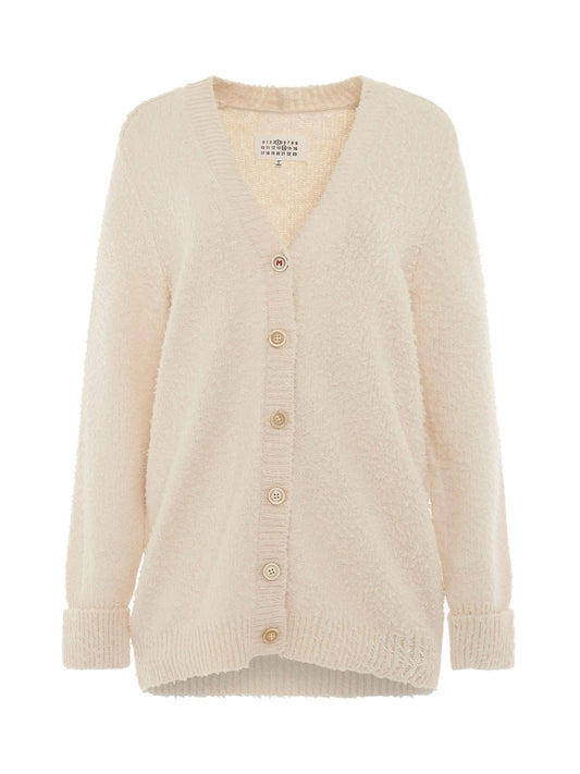 Image of a model wearing Outerwear. Productname: MAISON MARGIELA Oversized Piled Knit Cardigan in Off-White colour by brand - MAISON MARGIELA
