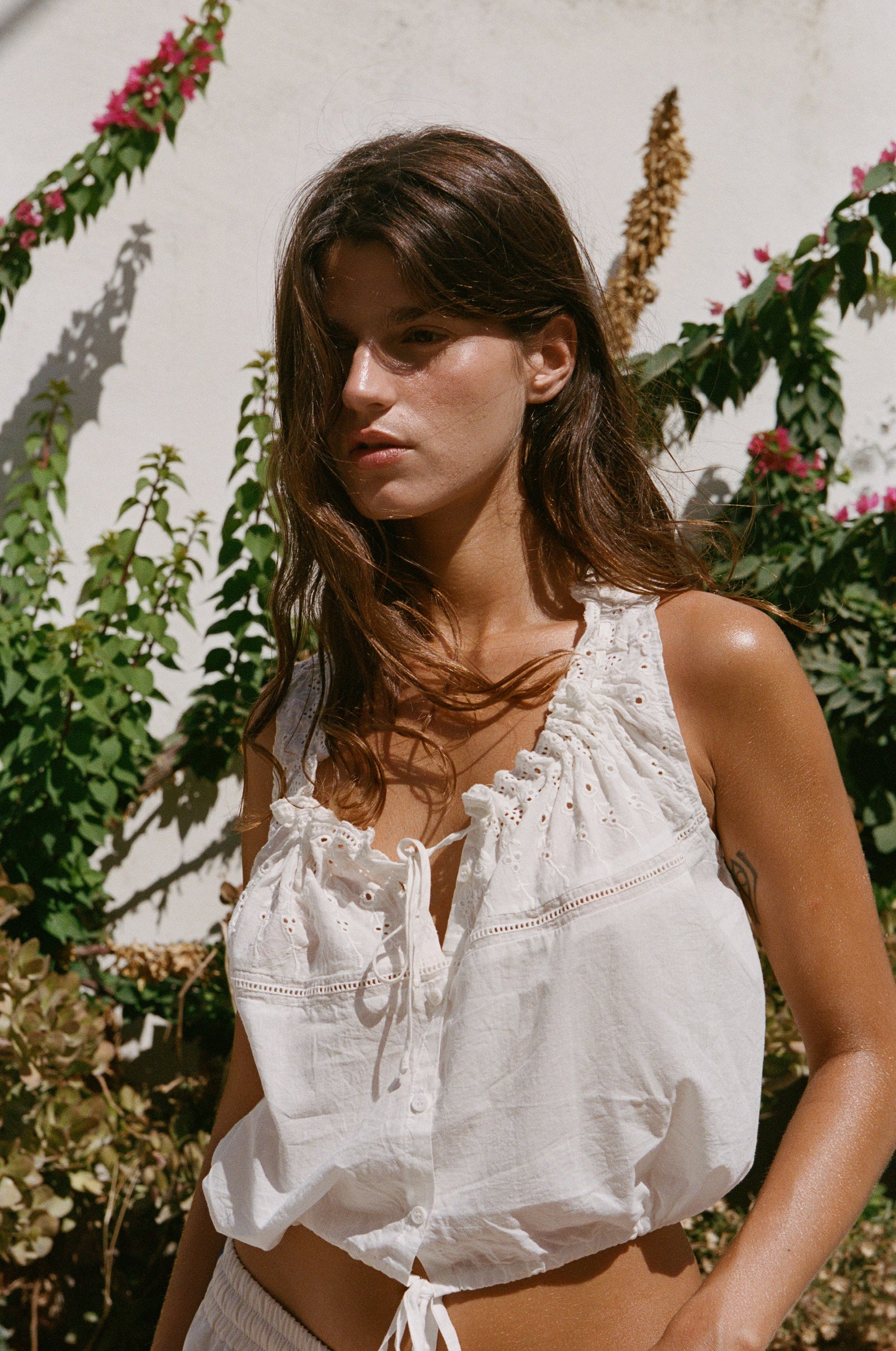 Image of a model wearing Tops. Product name - Simos Top in White colour by brand - With Jéan
