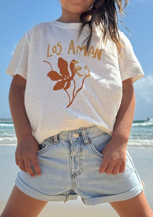 Image of a model wearing Tops. Productname: LITTLE AUGUSTE Spanish Lovers Classic Tee in White colour by brand - LITTLE AUGUSTE