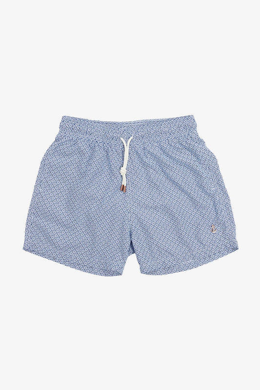 Image of a model wearing Shorts. Product name - Eufemia Blue Geometric Swim Shorts in Blue colour by brand - Anthony Squires
