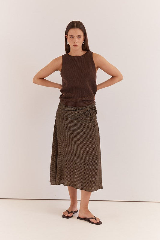 Image of a model wearing Skirts. Product name - Oriana Ruched Waist Skirt Micro Dot in Micro Dot colour by brand - Sass Clothing