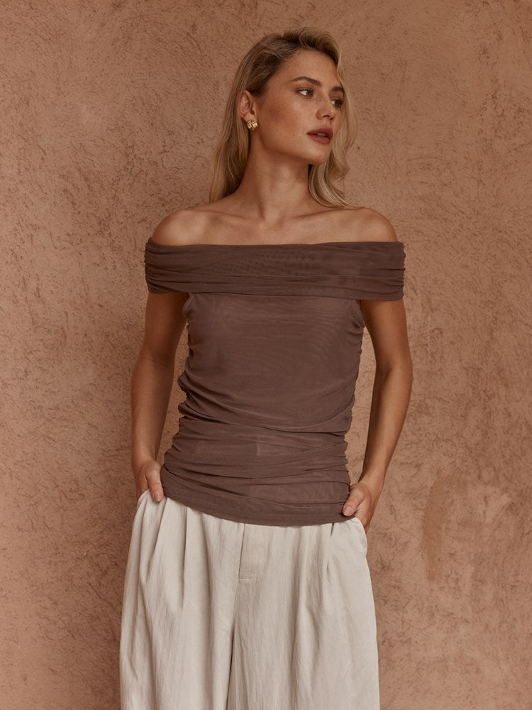 Image of a model wearing Tops. Product name - Jordan Off Shoulder Top Chocolate in Chocolate colour by brand - Sass Clothing