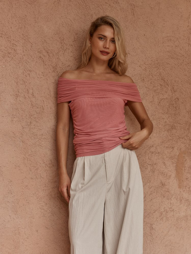Image of a model wearing Tops. Product name - Jordan Off Shoulder Top Burnt Pink in Burnt Pink colour by brand - Sass Clothing