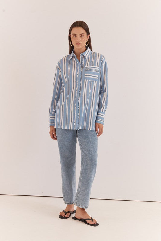 Image of a model wearing Tops. Product name - Nyx Piped Stripe Shirt in Blue Stripe colour by brand - Sass Clothing
