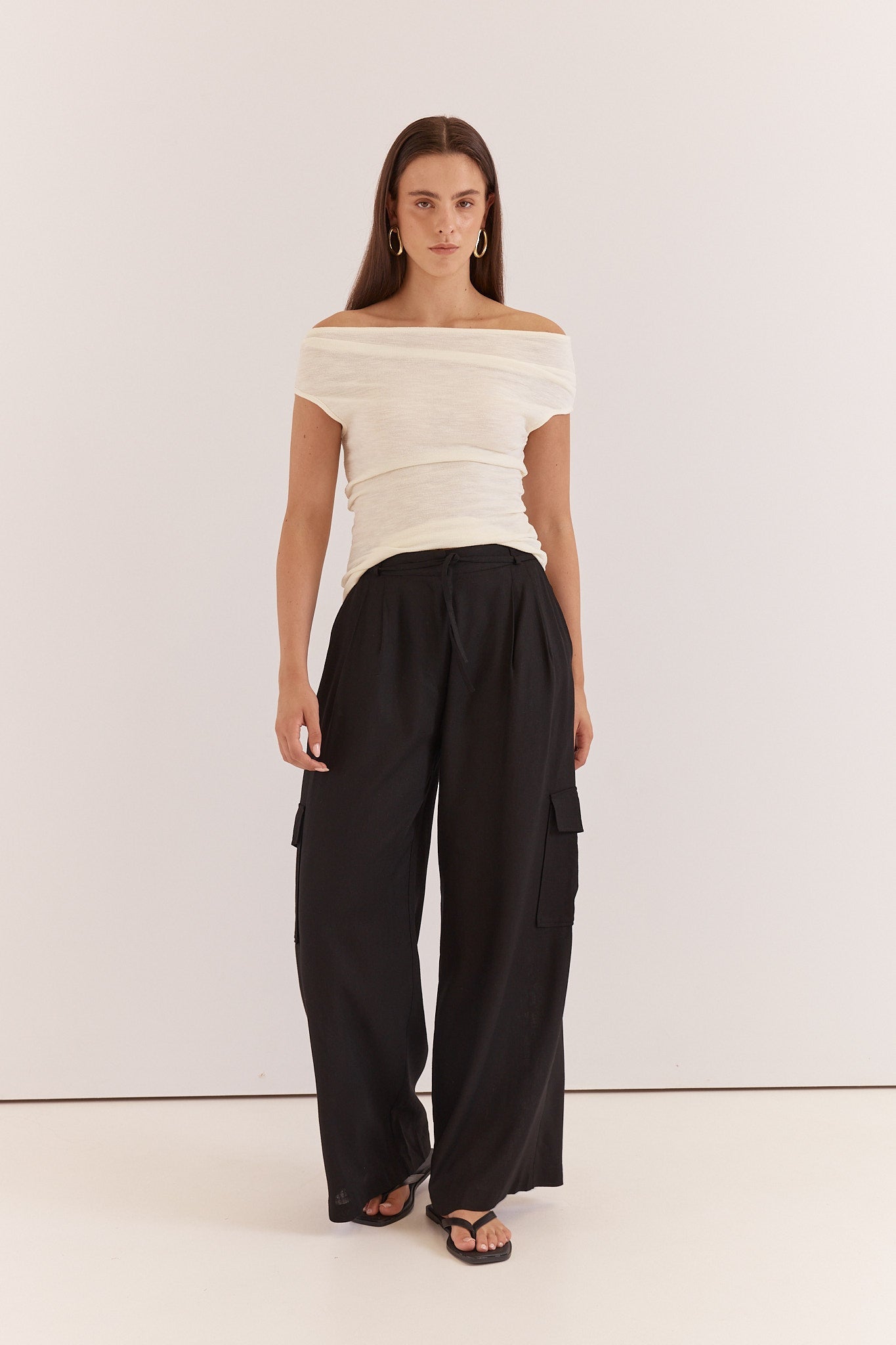 Image of a model wearing Pants. Product name - Katia Cargo Trouser in Black colour by brand - Sass Clothing
