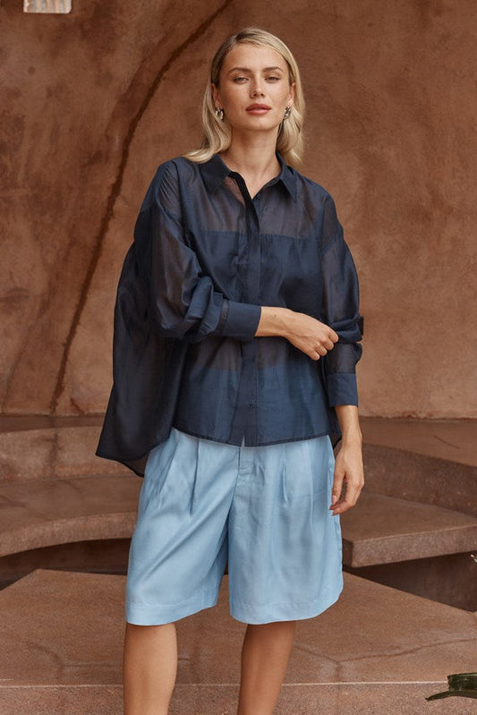 Image of a model wearing Tops. Product name - Val Oversized Shirt Navy in Navy colour by brand - Sass Clothing