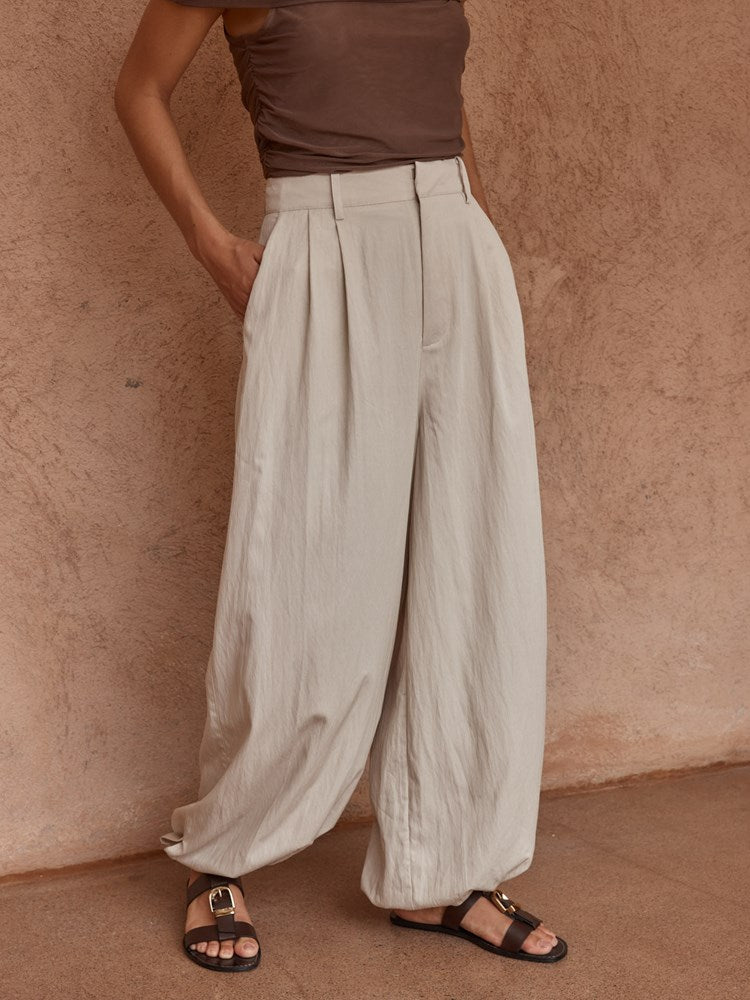Image of a model wearing Pants. Product name - Lucie Soft Balloon Pant Stone in Stone colour by brand - Sass Clothing