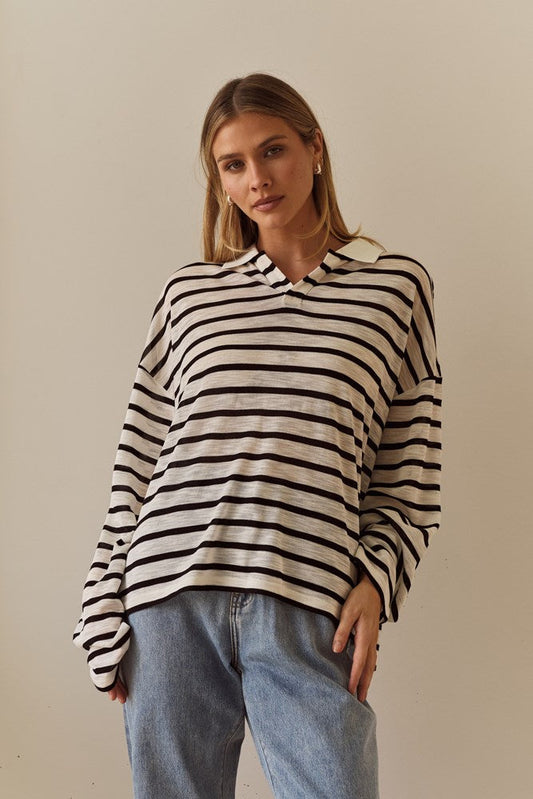 Image of a model wearing Tops. Product name - Tate Rugby Top in White Black colour by brand - Sass Clothing