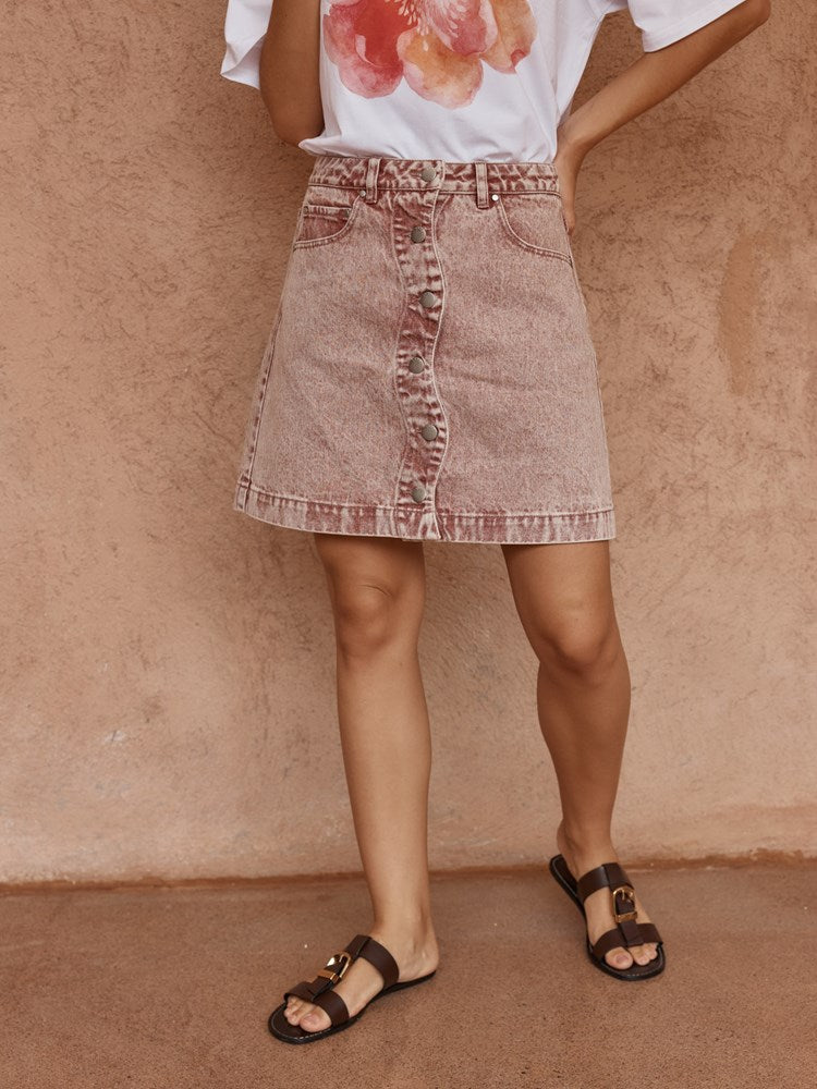 Image of a model wearing Skirts. Product name - Tipo Wave Denim Skirt Rusty Red in Rusty Red colour by brand - Sass Clothing