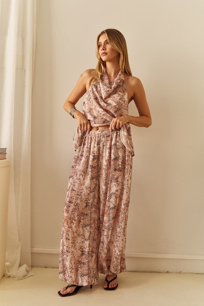 Image of a model wearing Pants. Product name - Miles Balloon Pant in Snake colour by brand - Sass Clothing