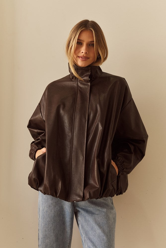 Image of a model wearing Outerwear. Product name - Milo Leather Look Bomber in Chocolate colour by brand - Sass Clothing